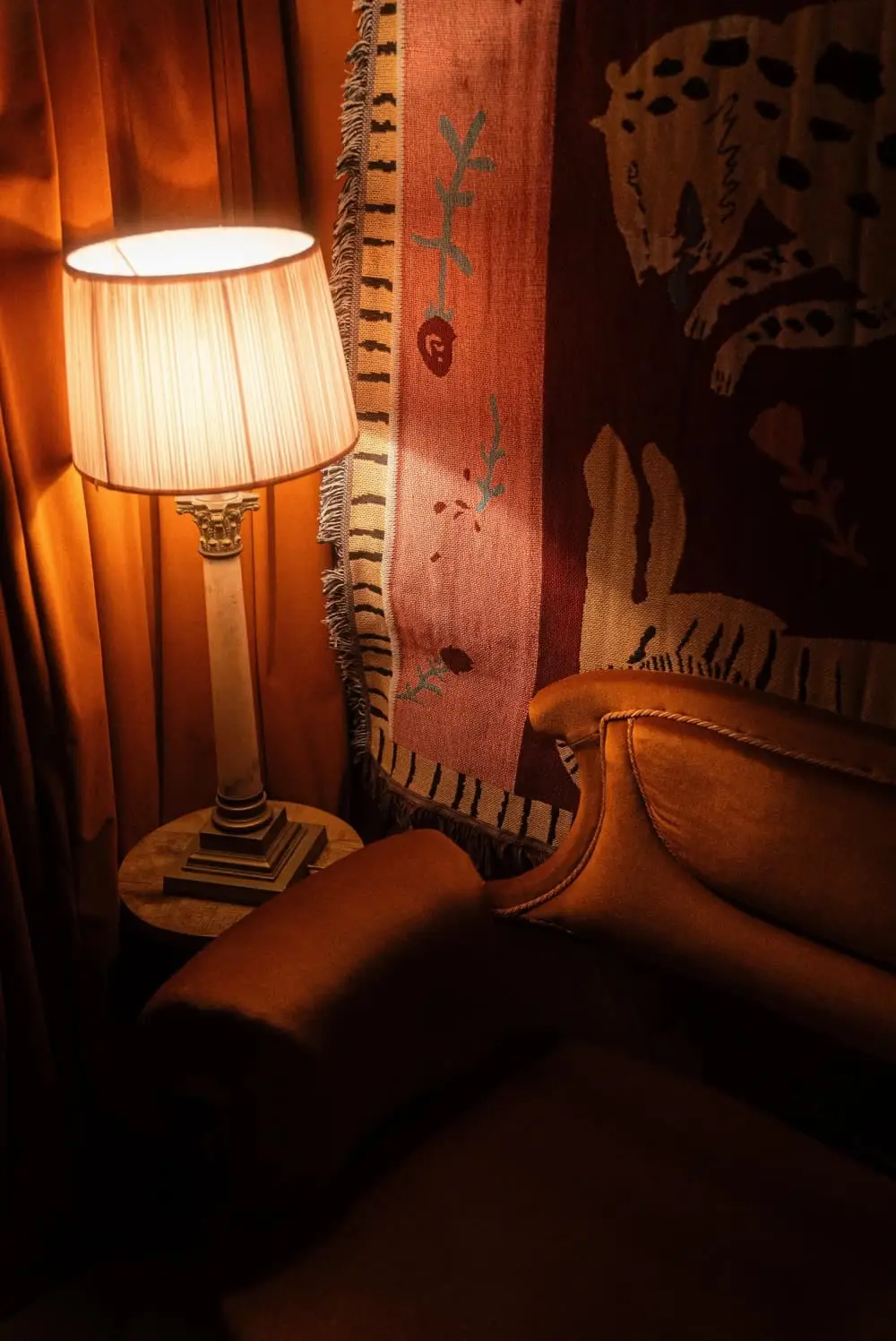 A standard lamp beside a painting in the basement